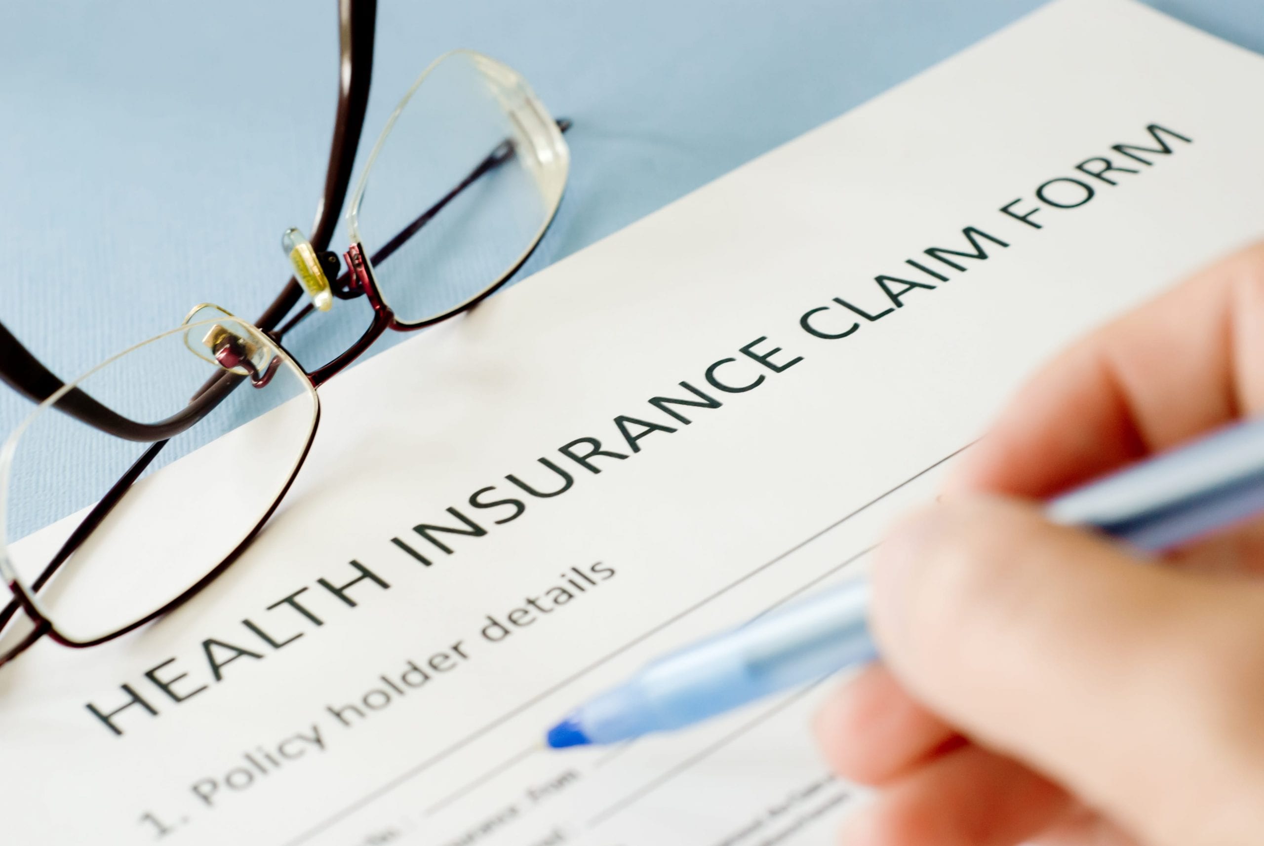 filling out a health insurance claim form