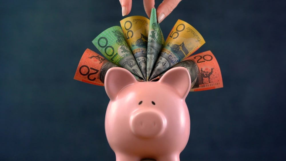 piggy bank with Australian dollar notes
