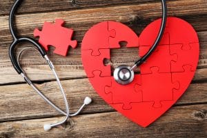 jigsaw puzzle heart with stethoscope on missing piece