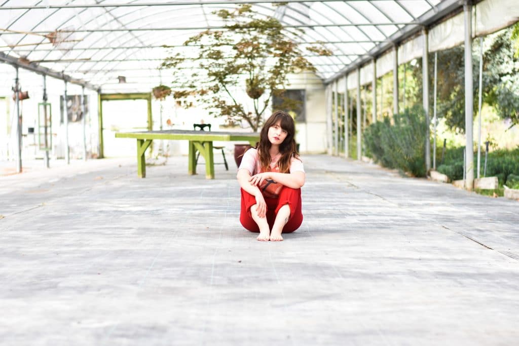 woman sitting on her own