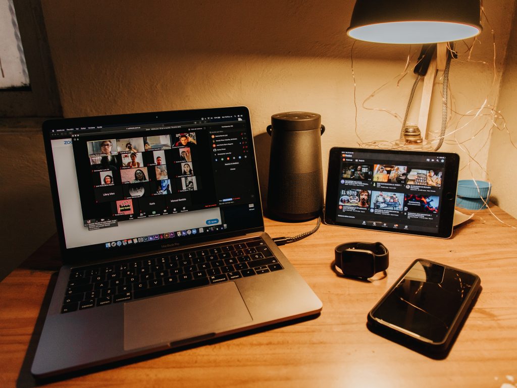 laptop and tablet showing conference call