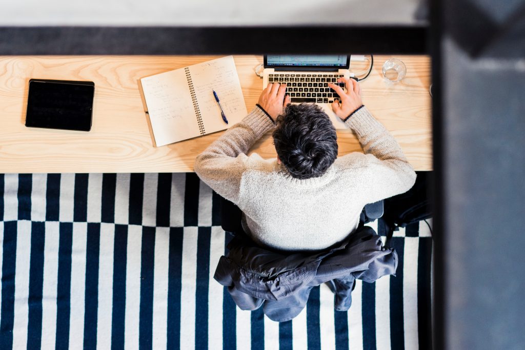 aerial view of man working at his desk